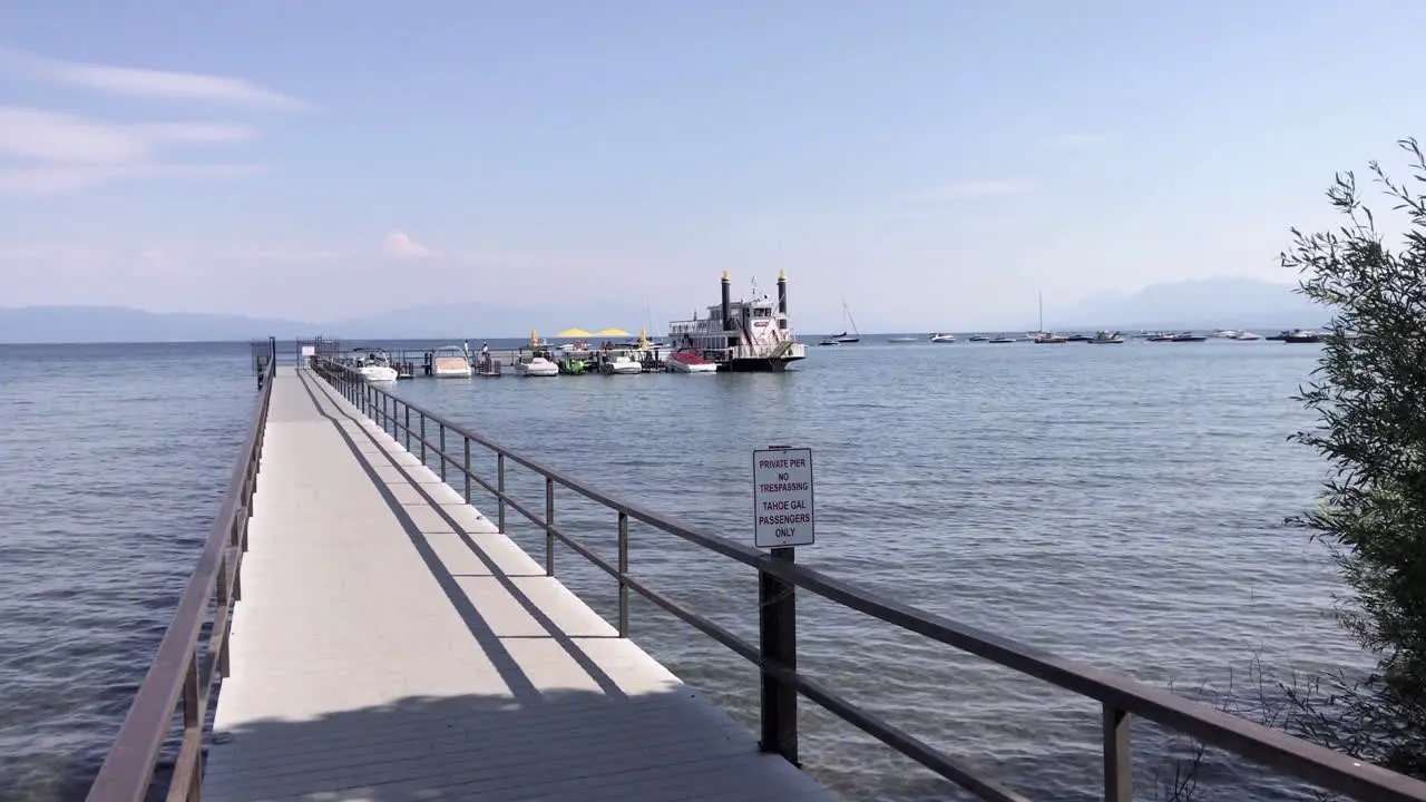 A pier extending to a paddle-wheeler on Lake Tahoe