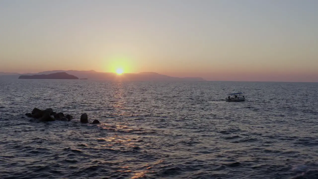 Aerial Fishing boat in Chania Greece at sunset