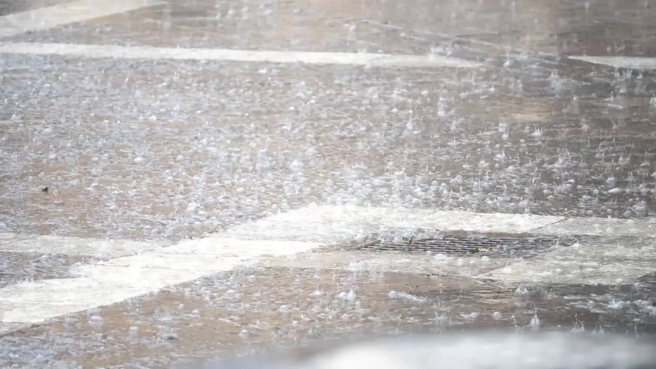 Raindrops falling to the pavement in Valletta Malta