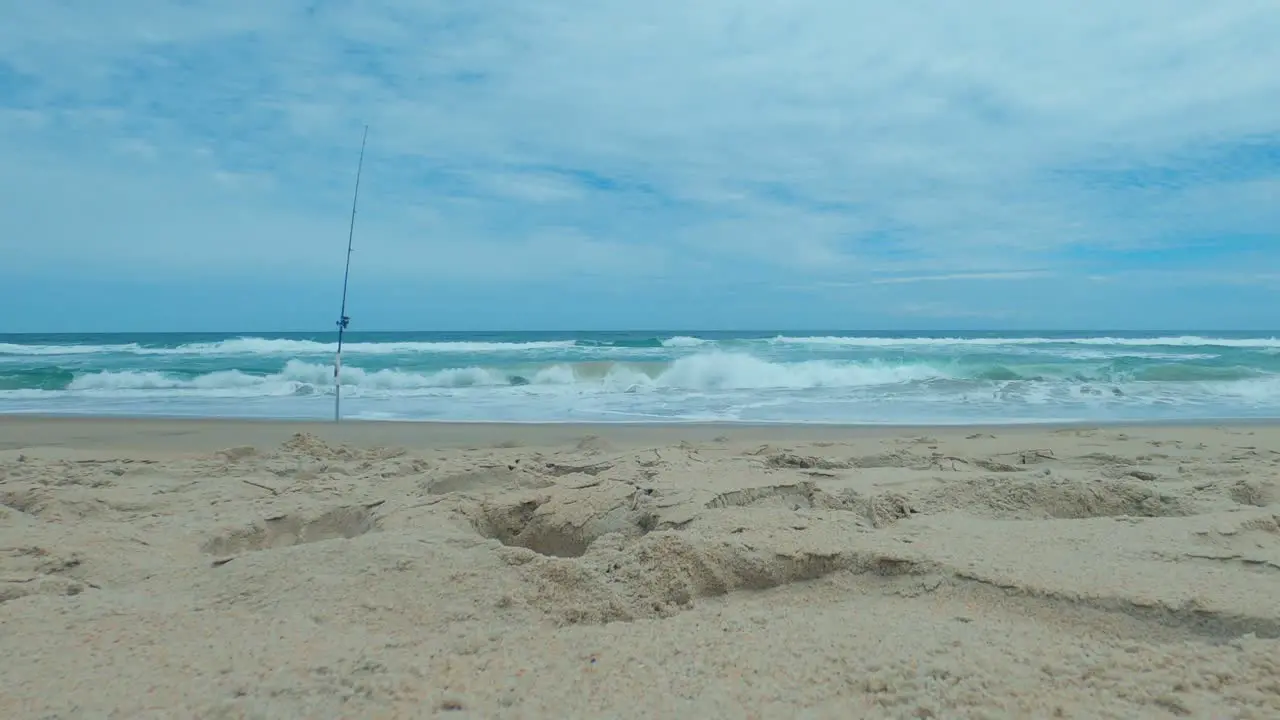 Beautiful time lapse on a sunny day on a calm pristine beach with blue skies in North Carolina in the Outer Banks in Nags Head during early summer