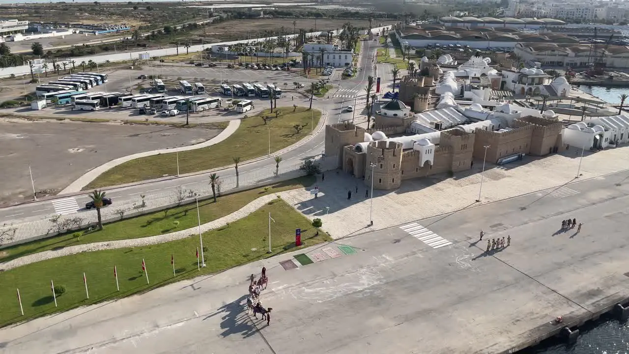 View of the skyline and camel handler welcoming MSC Grandiosa cruise ship docking at La Goulette Cruise Port in Tunisia North Africa