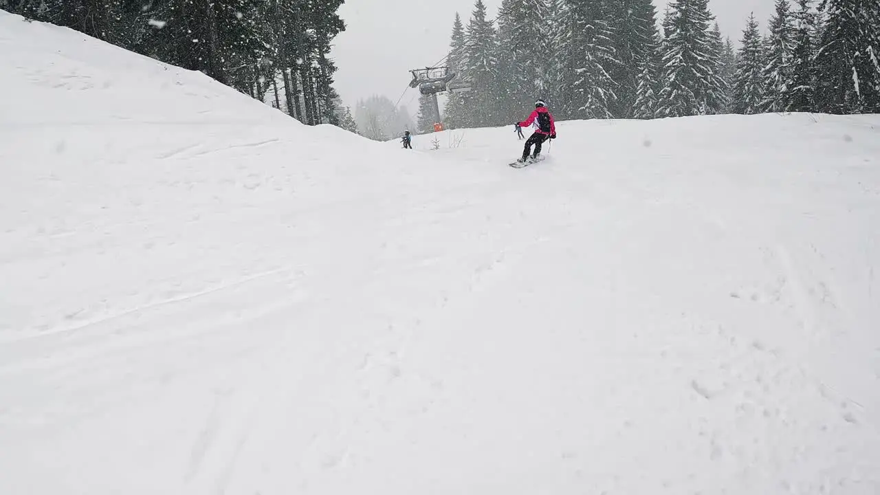 Low angle POV Shot Of Skier Skiing Down Misty Snow Covered Slope 2