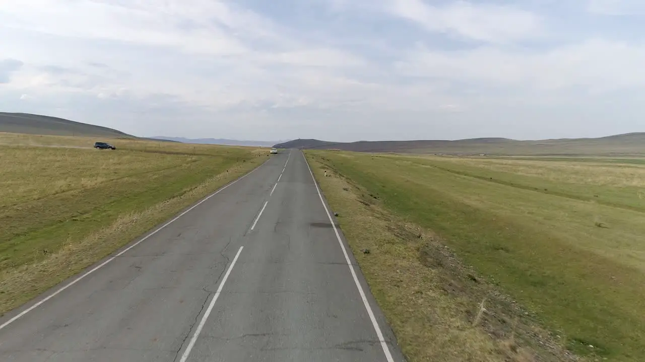 Flying Over Road to Car