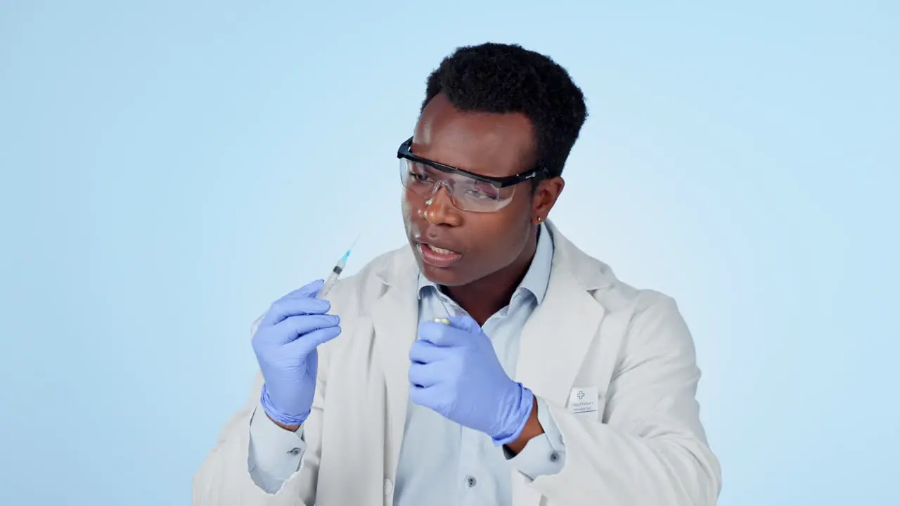 Science man and syringe in studio for vaccine