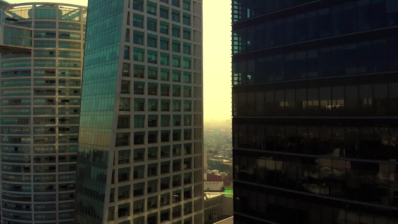 drone shot revealing tall buildings golden hour Mexico city