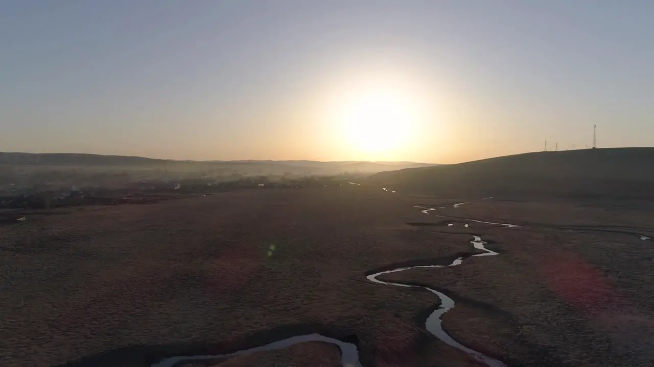 Flying over the river in sun rays