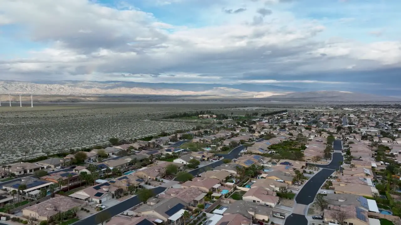 Desert Park Estates community houses next to the desert with windmills