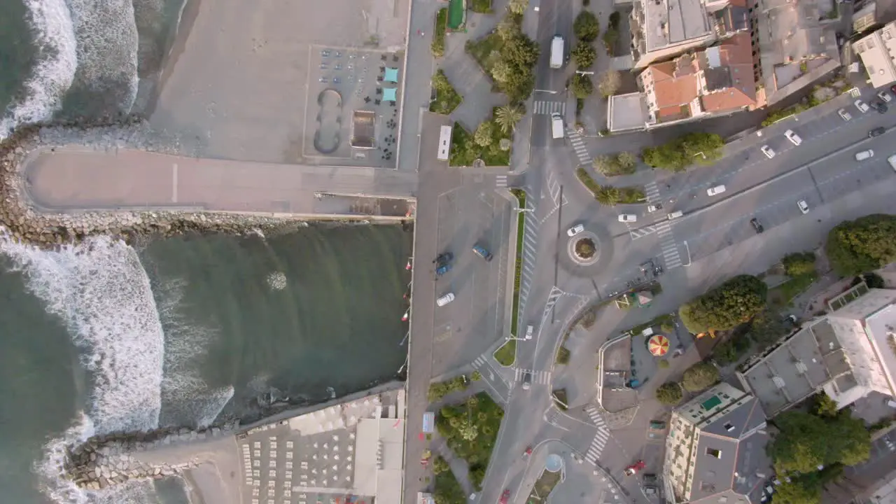 drone shot of light morning traffic on the west coast of italy in varazze in a small city