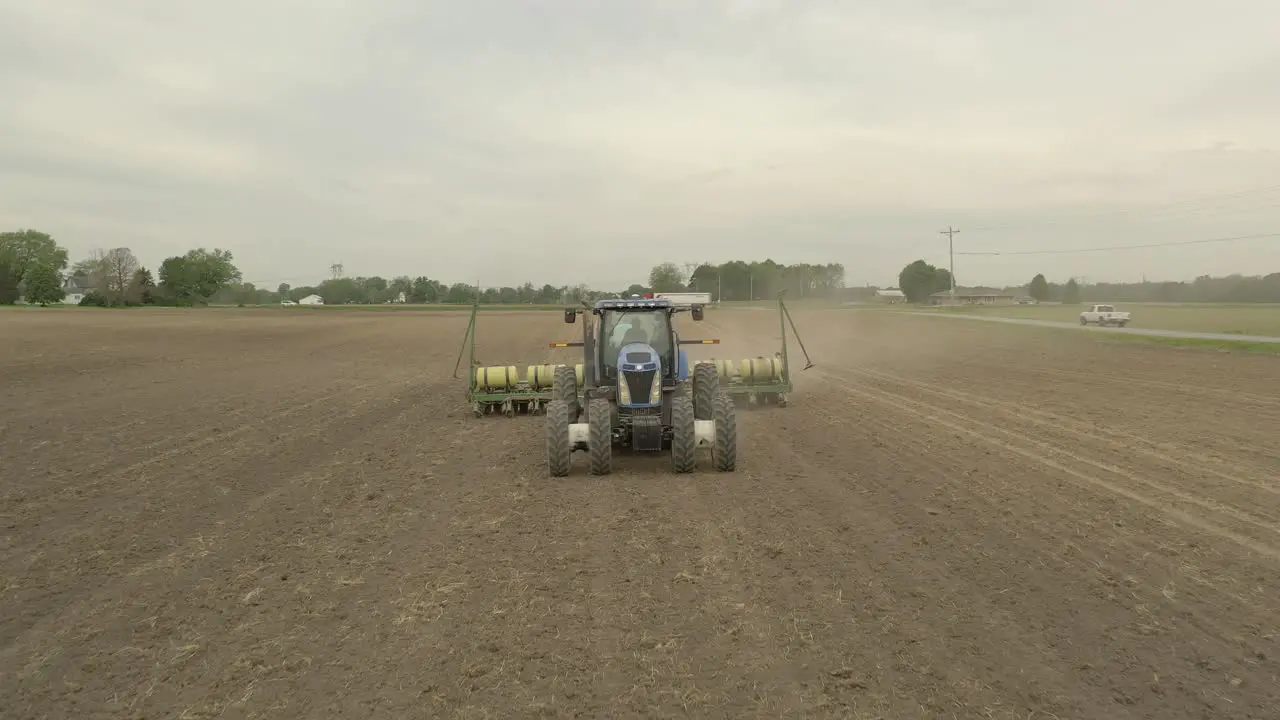 Farmer in tractor planting crop in field take 6