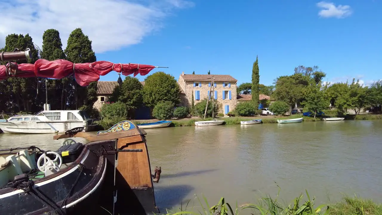 Barges and boats docked on canal side canal Du Midi France