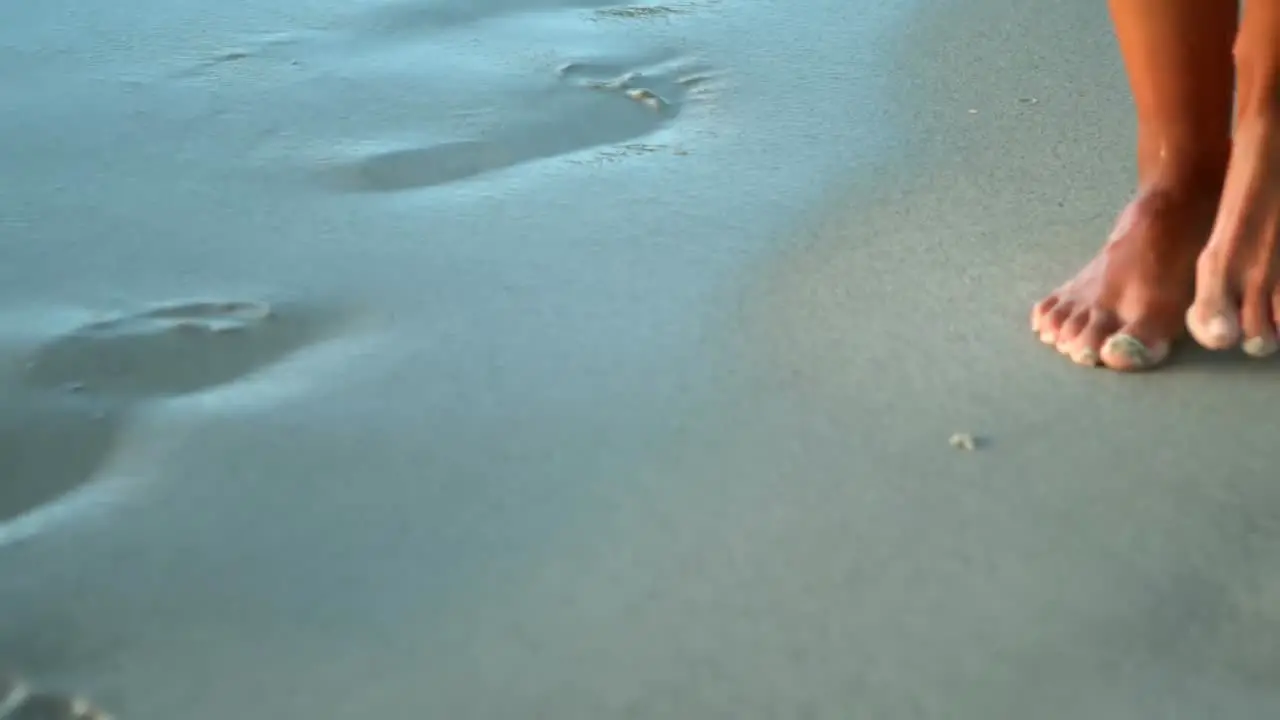 Woman walking on beach