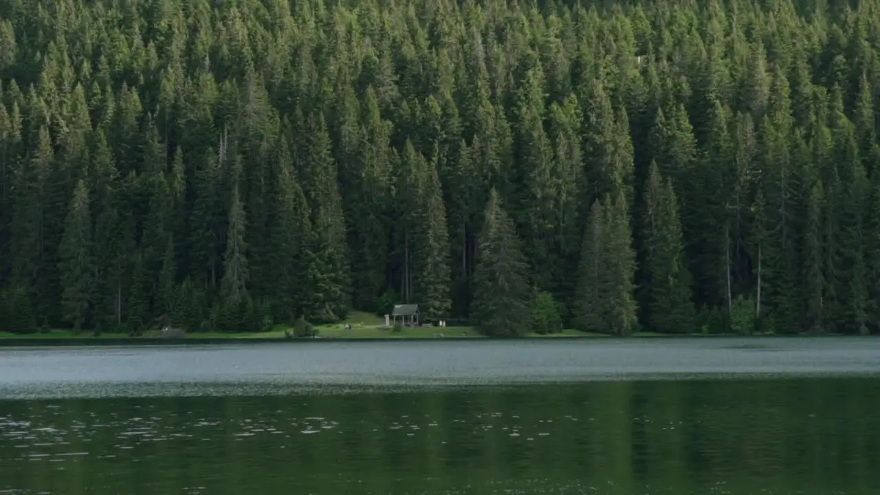 Calm water and people in the distance at Black Lake Montenegro