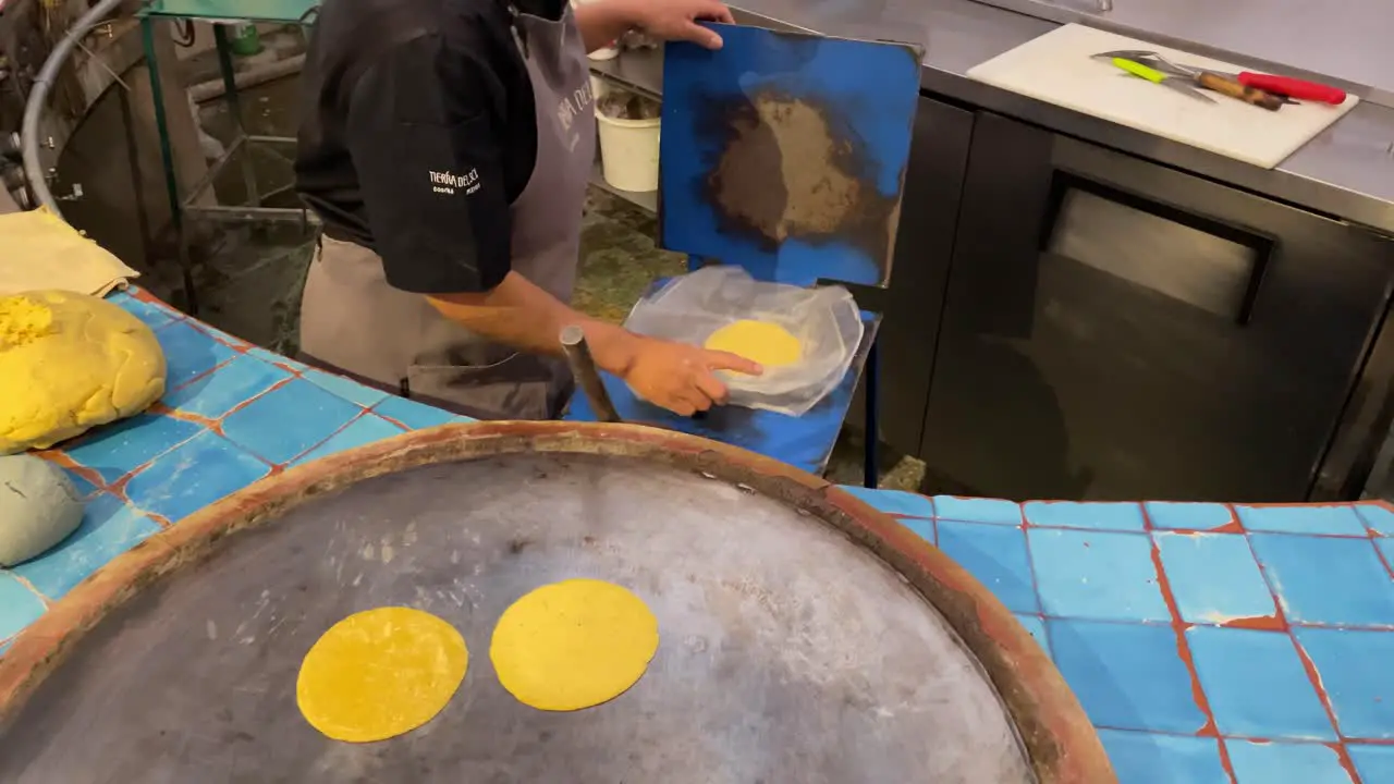 slow motion shot of a person preparing tortillas in oaxaca