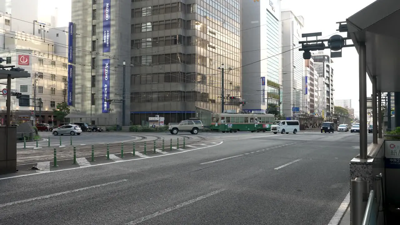 Vintage Hiroden Streetcar Turning On Road In Hiroshima