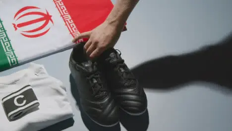 Studio Still Life Shot Of Football Soccer Boots Iranian Flag Shirt And Shorts And Captains Armband 1