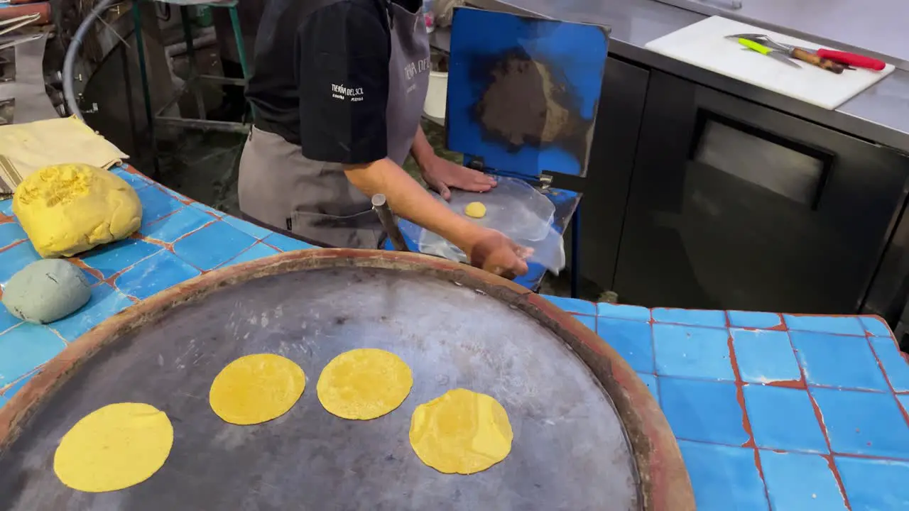 slow motion shot of a person preparing tortillas