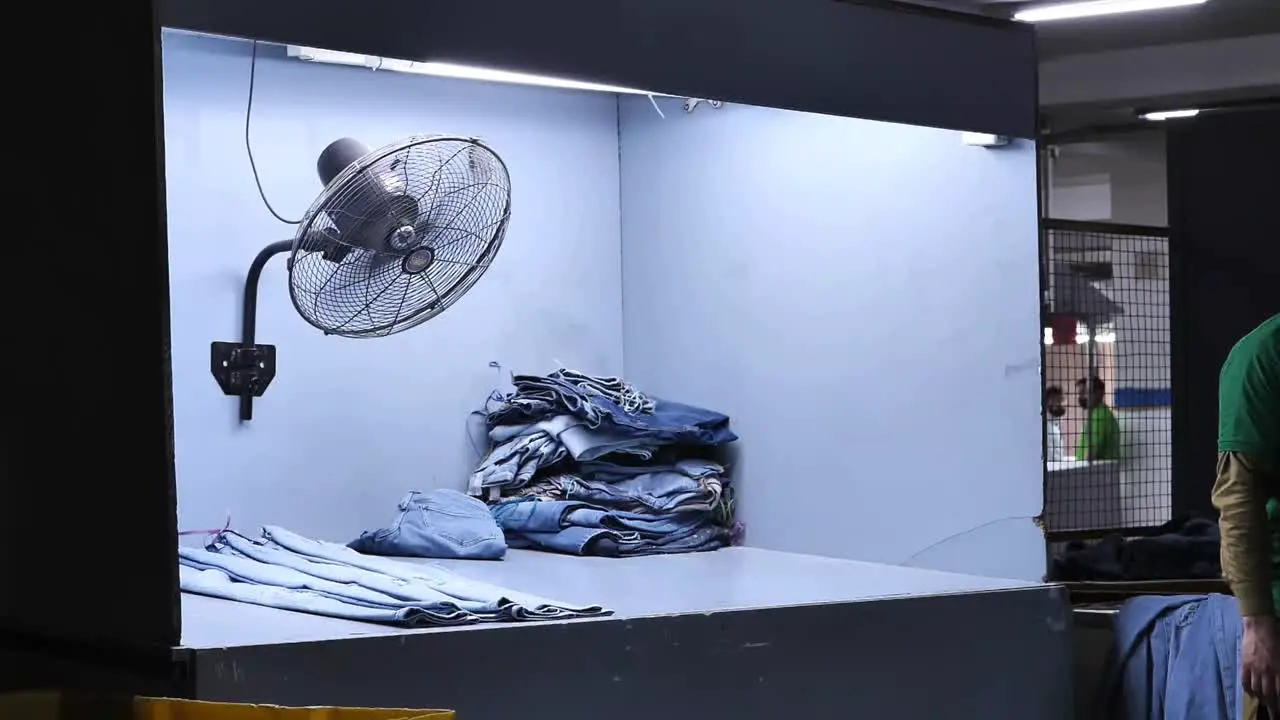 Drying Box With Fan Spinning With Jeans Laid Out Flat In Factory In Karachi Pakistan