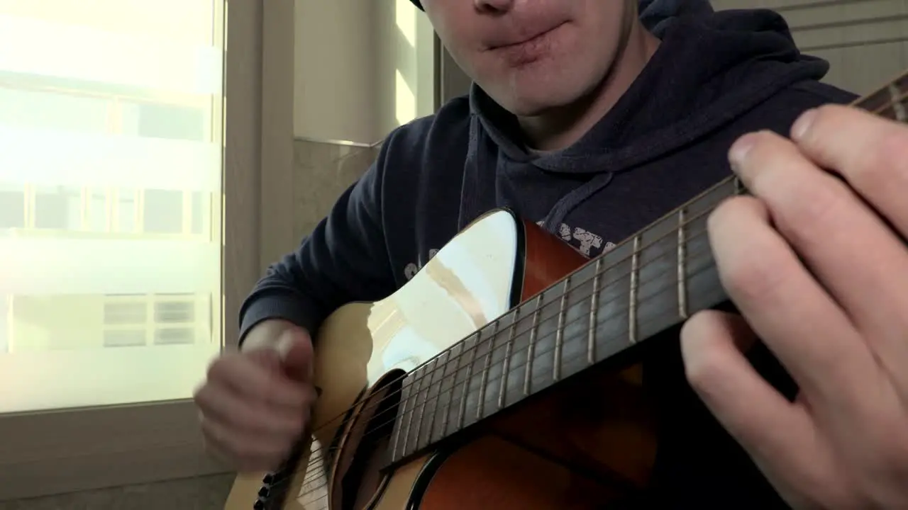 Man playing a guitar in slowmo