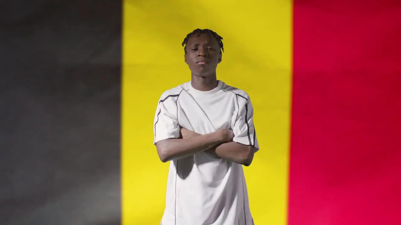 Young Footballer Posing In Front of Belgium Flag 02