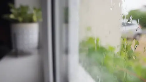 Looking Out Of Window Through Rain To Urban Residential Street 4