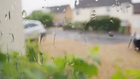 Looking Out Of Window Through Rain To Urban Residential Street 3