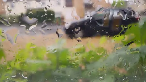 Looking Out Of Window Through Rain To Urban Residential Street 1