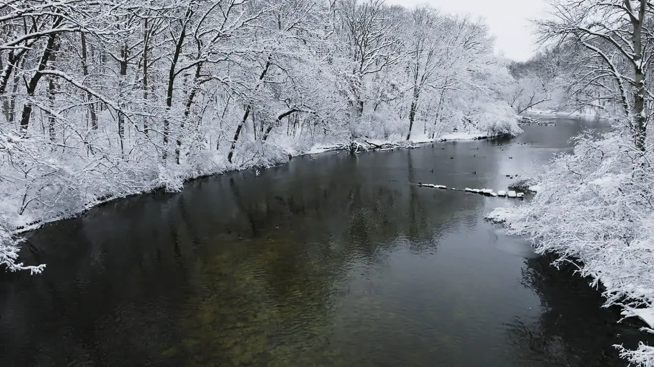 A drone's cinematic sweep above the snow-laden Huron River Valley landscape