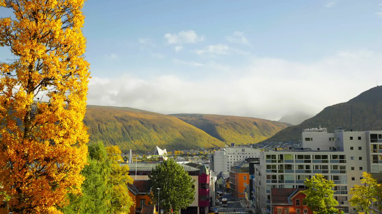 Panning right across Tromso city on coast of Norway in autumn season