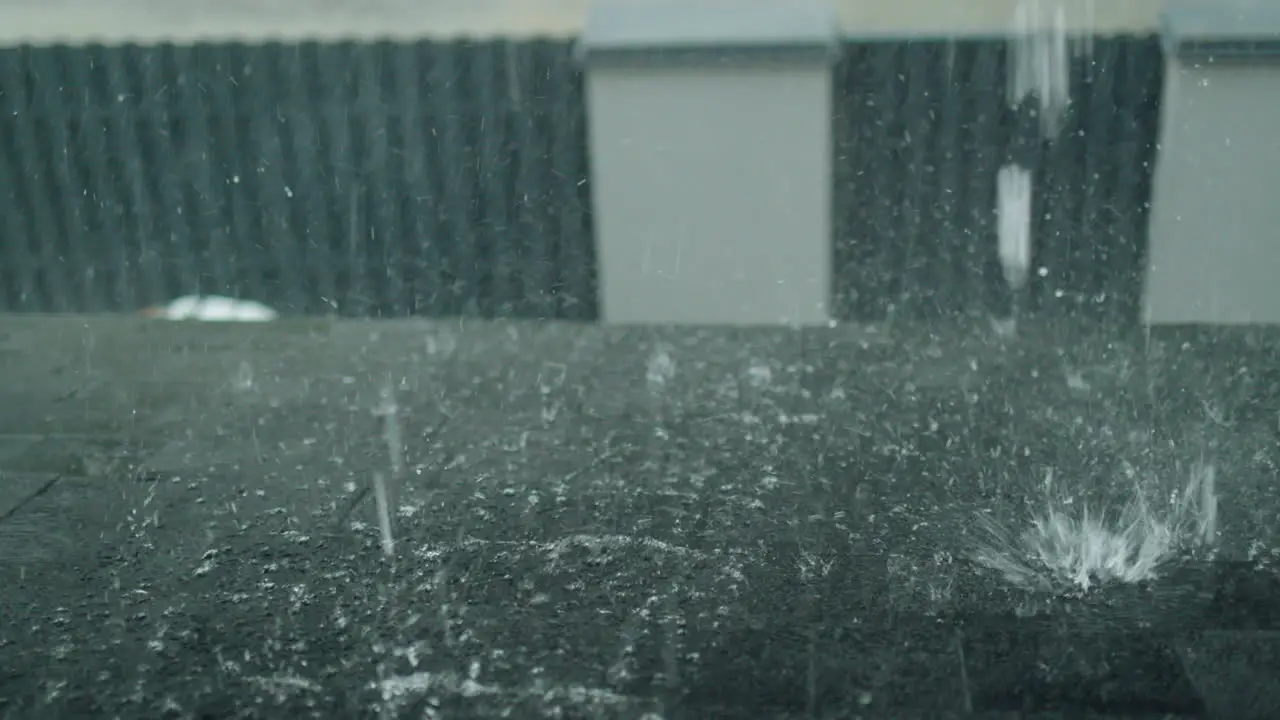 View from the window of the house on the part of the roof where there is a heavy downpour