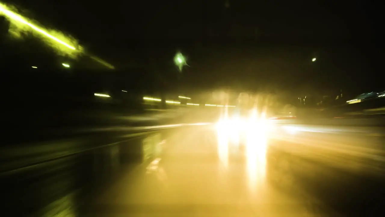 Hyperlapse of a drive through Los Angeles on a rainy night abstract