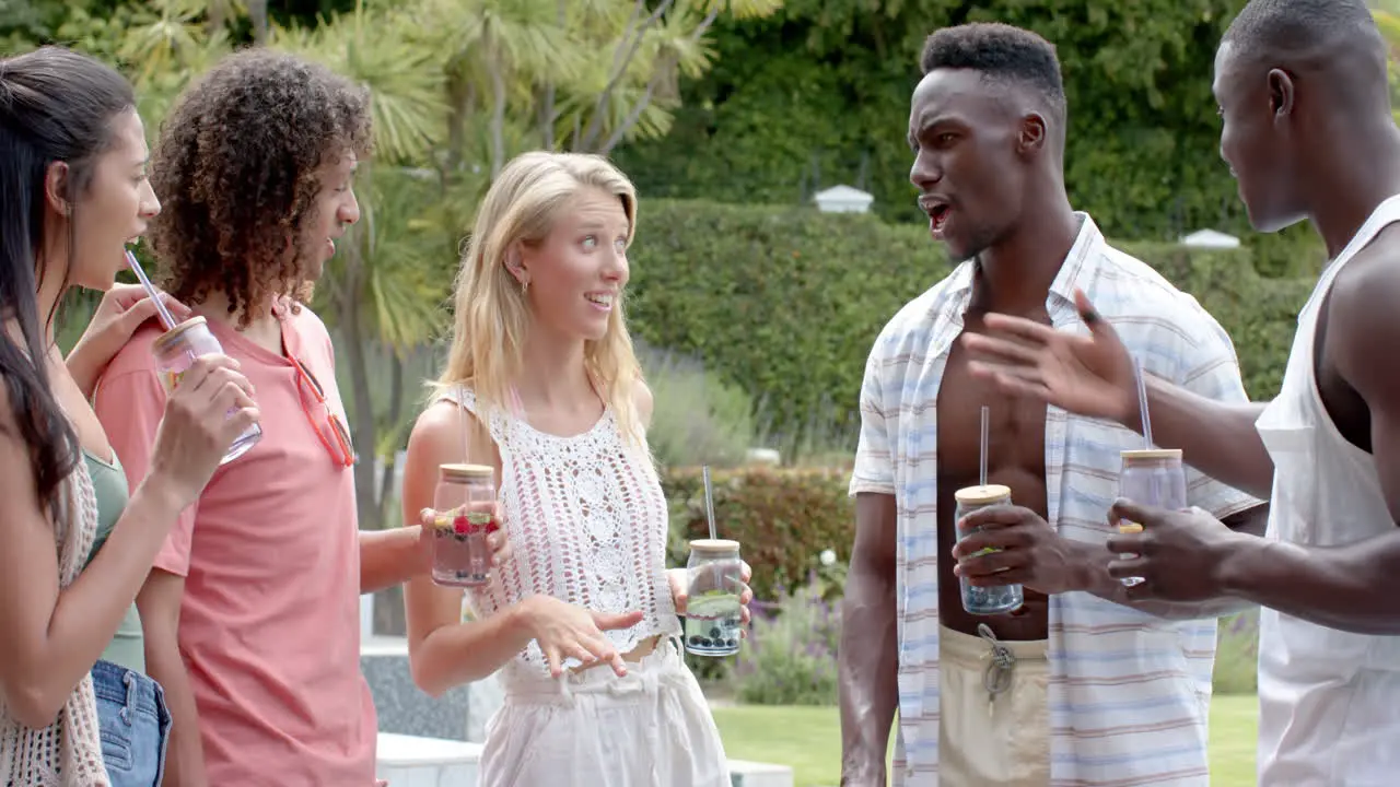 Diverse friends enjoy a lively conversation outdoors