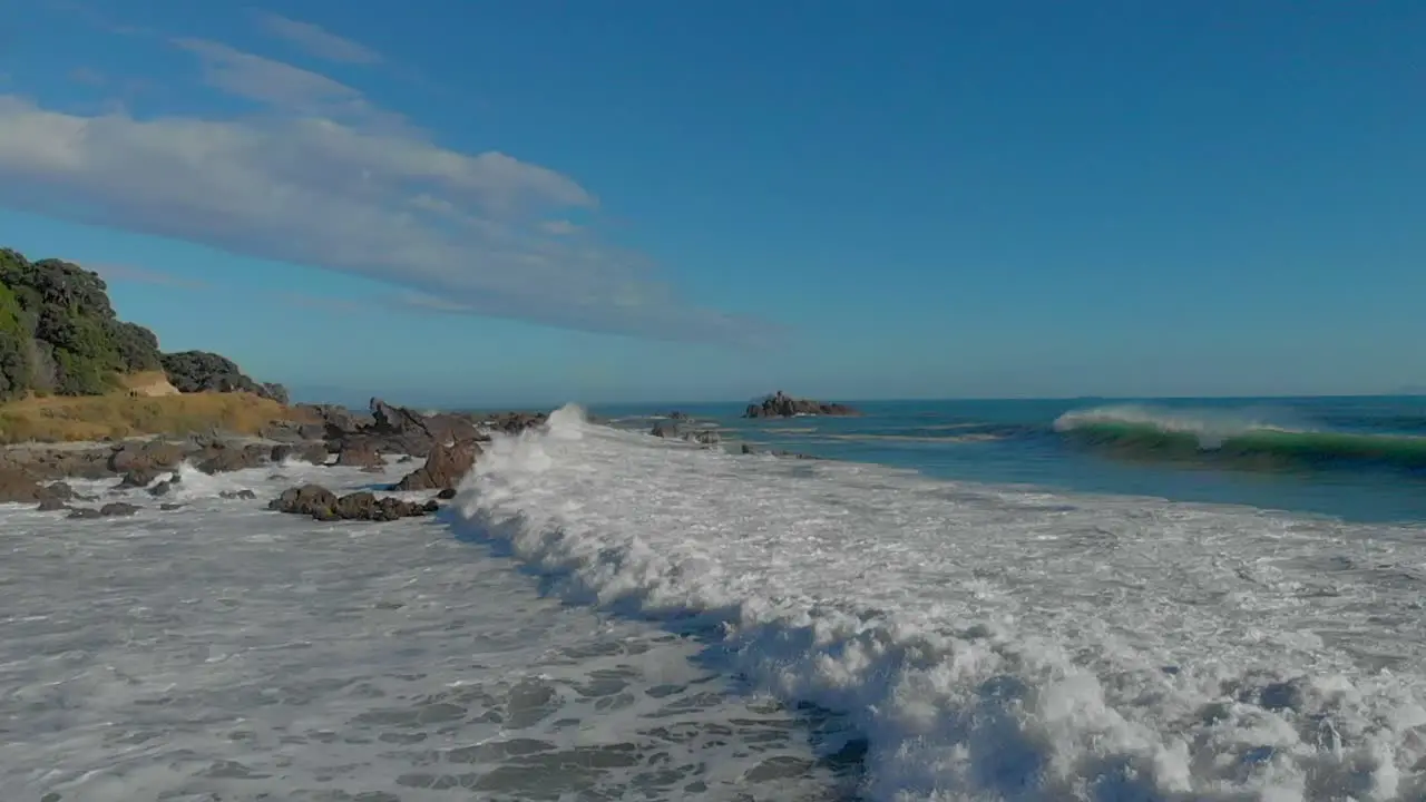 AERIAL SLOW MOTION Waves breaking over rocks clip 6