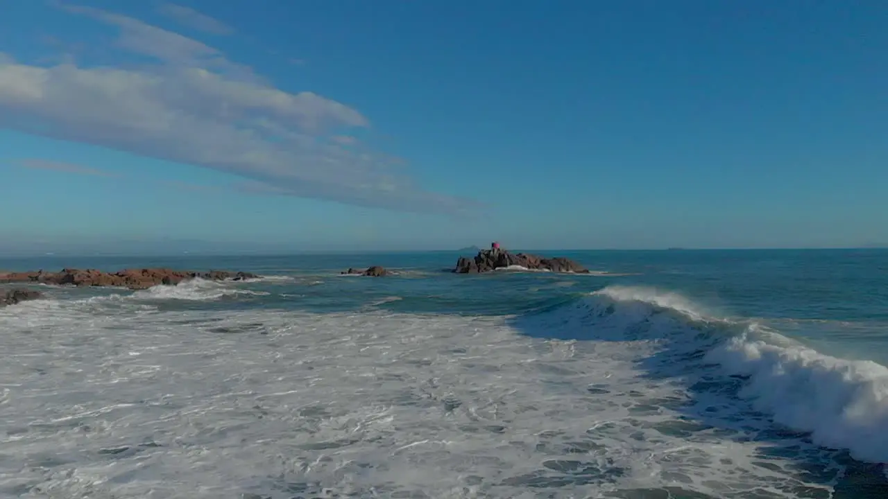 AERIAL SLOW MOTION Waves breaking over rocks clip 2