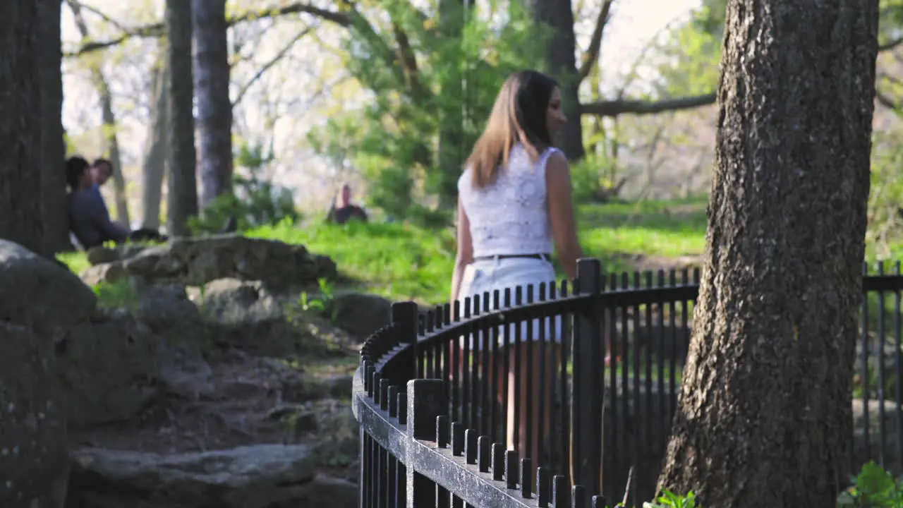 Attractive young woman walking in a park