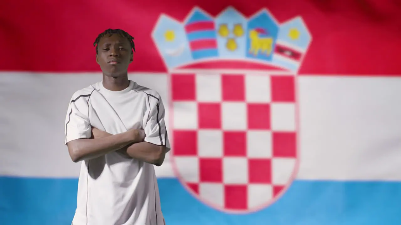 Young Footballer Posing In Front of Croatia Flag 02