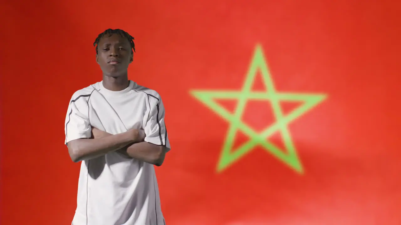 Young Footballer Posing In Front of Morocco Flag 02