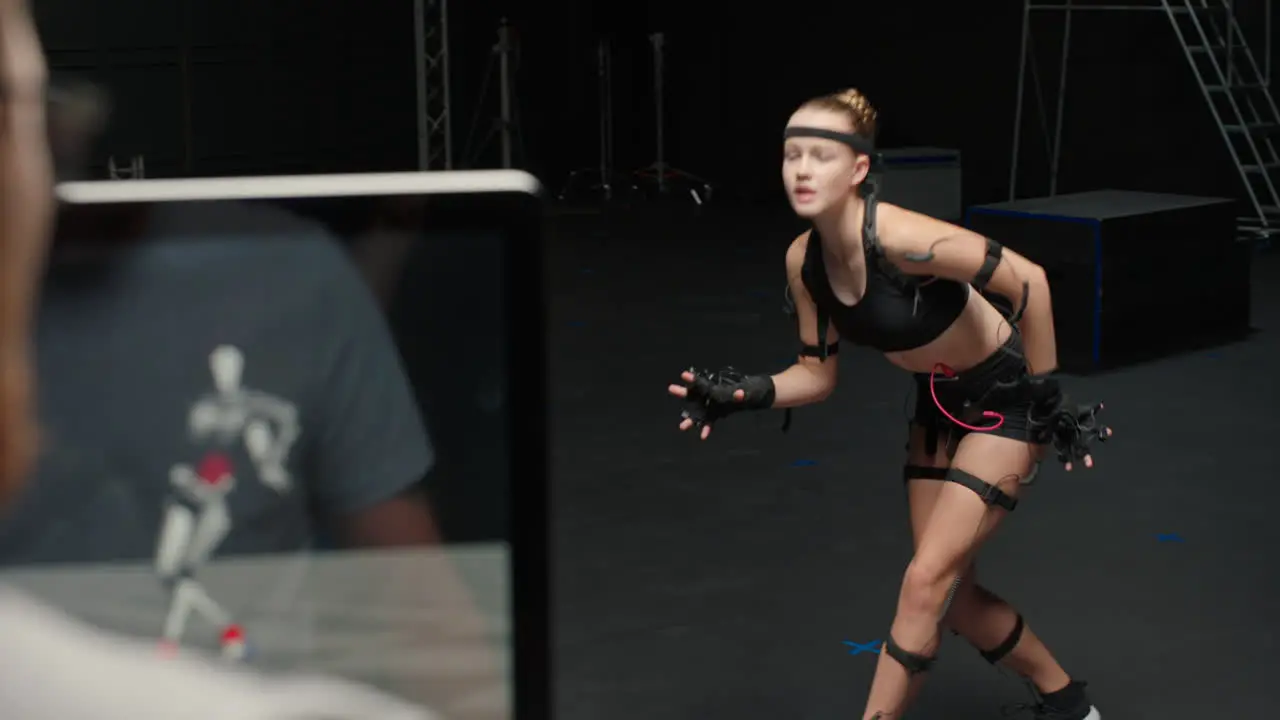 woman wearing motion capture suit in studio actor performing animal movements wearing mo-cap suit for 3d character animation for virtual reality technology