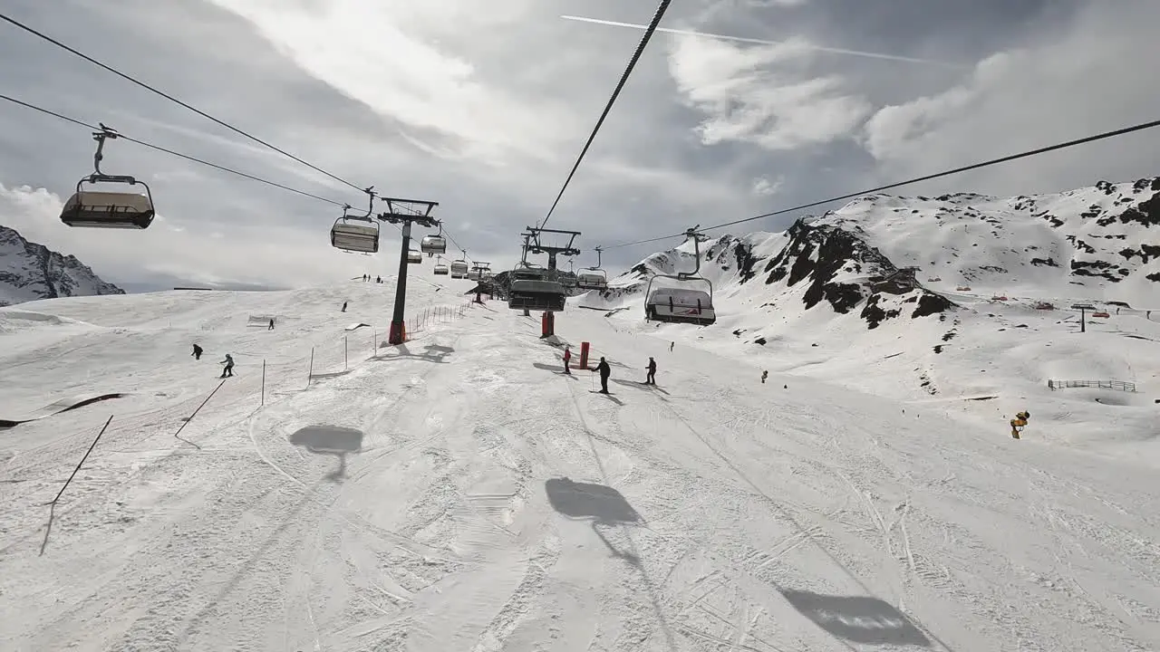 POV Shot Of Skier On Chair Lift Across Snow Covered Mountain Solden Austria