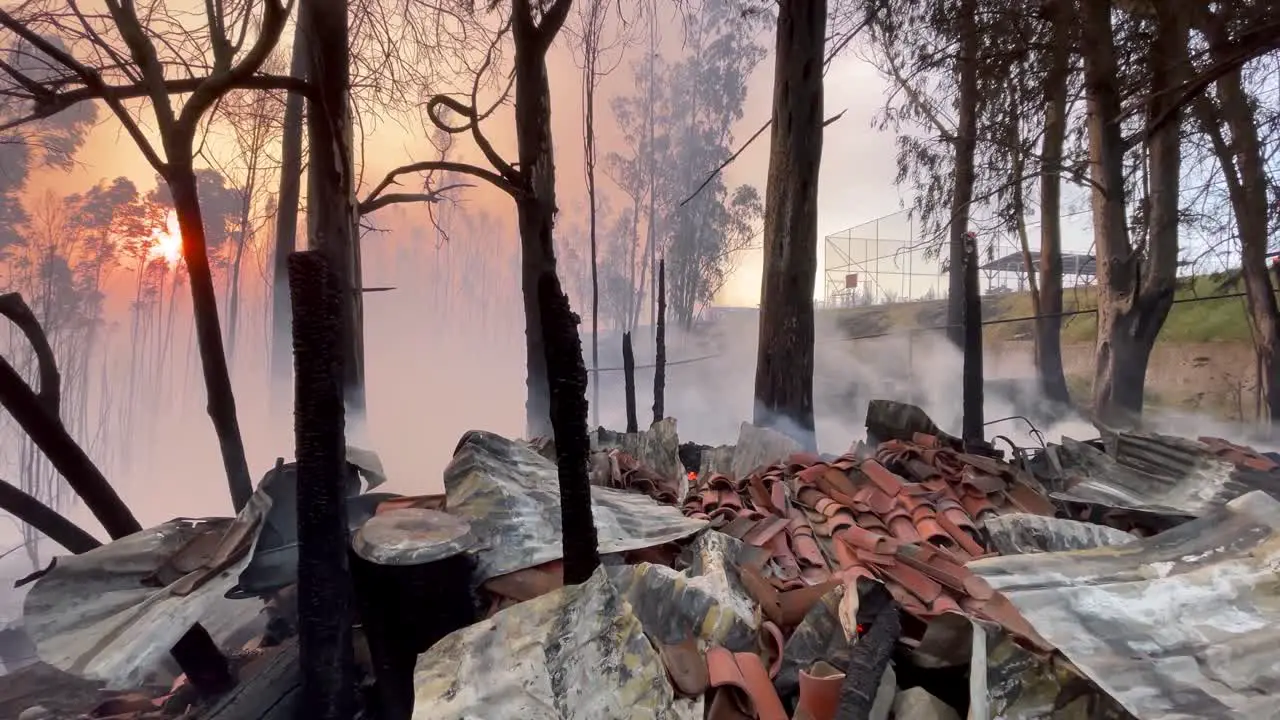 Smokes rises from a burnt house