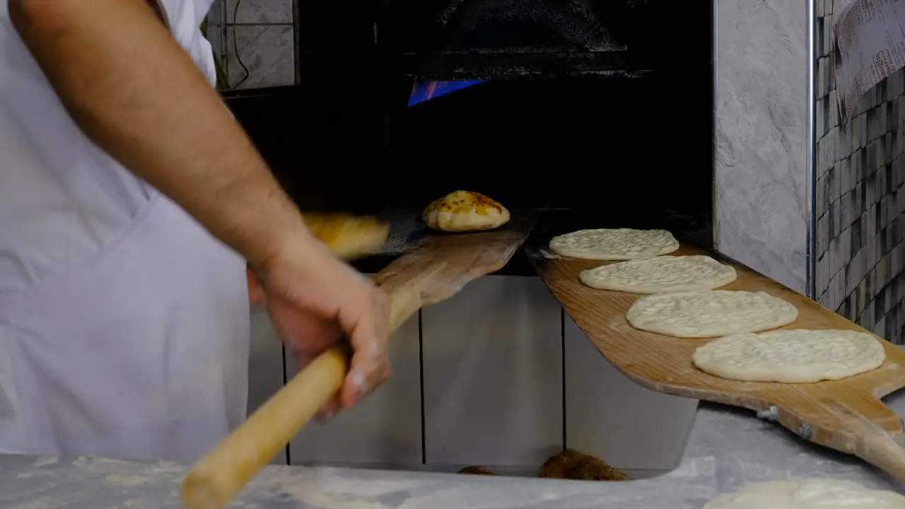 Baking bread baking bread putting raw dough oven