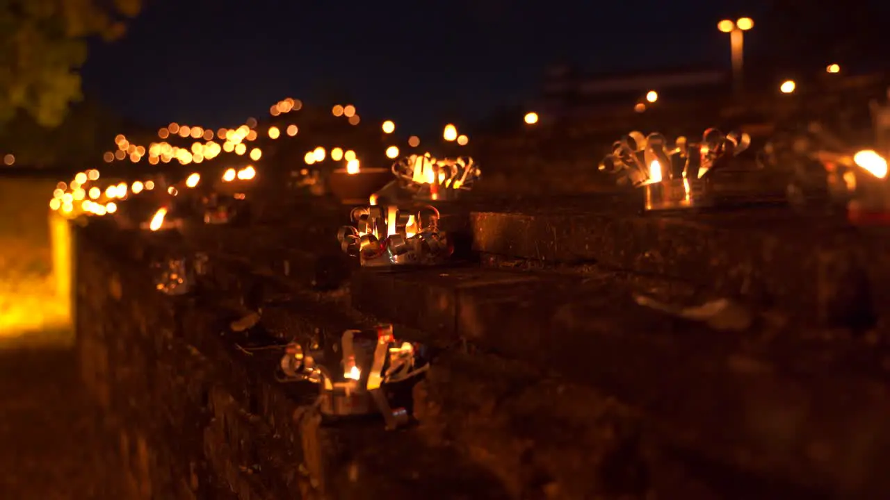 Close up of candles burning on stone walls of Chiang Mai Thailand