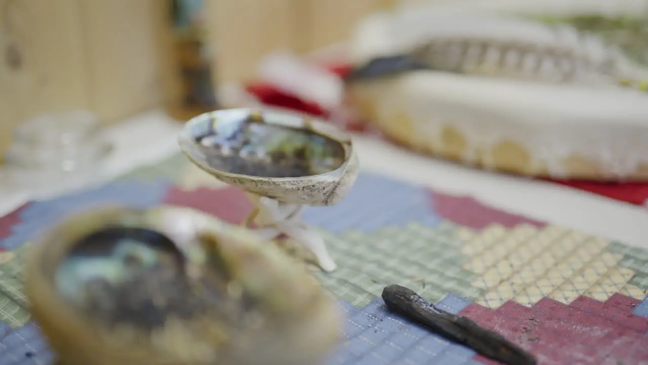 Indigenous canadian smudging station close up rack focus