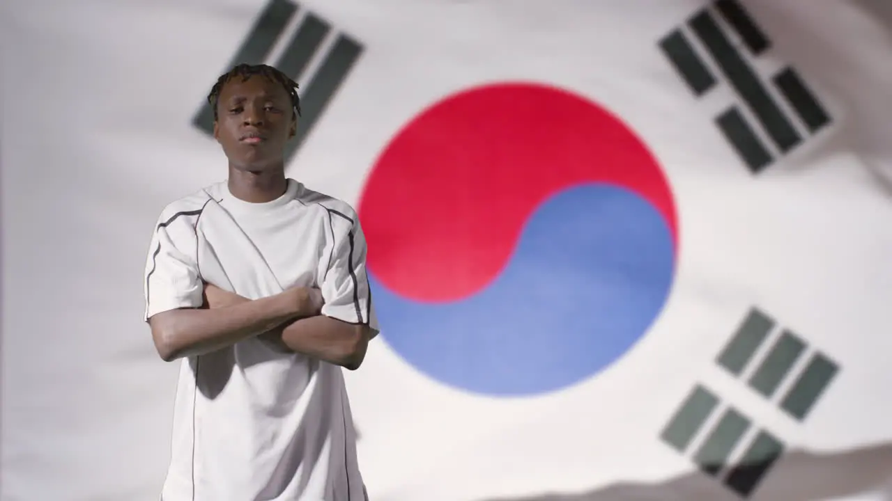 Young Footballer Posing In Front of South Korea Flag 02