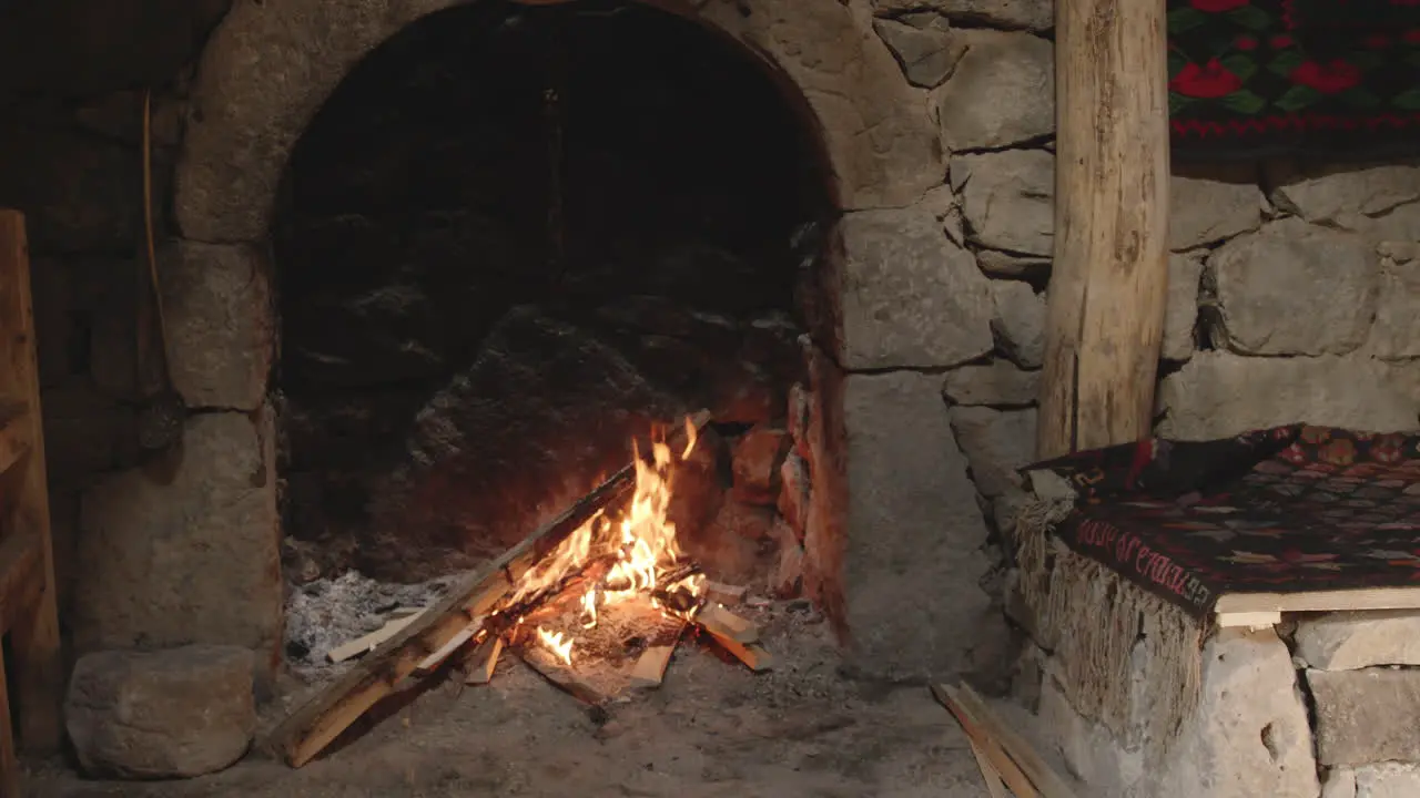 Fire on Logs in Fireplace Heating for Cheese Making Process Chobareti Georgia