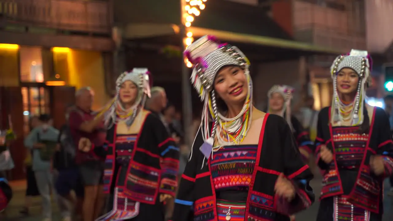 Happy Thai tribal women dancing and smiling at parade