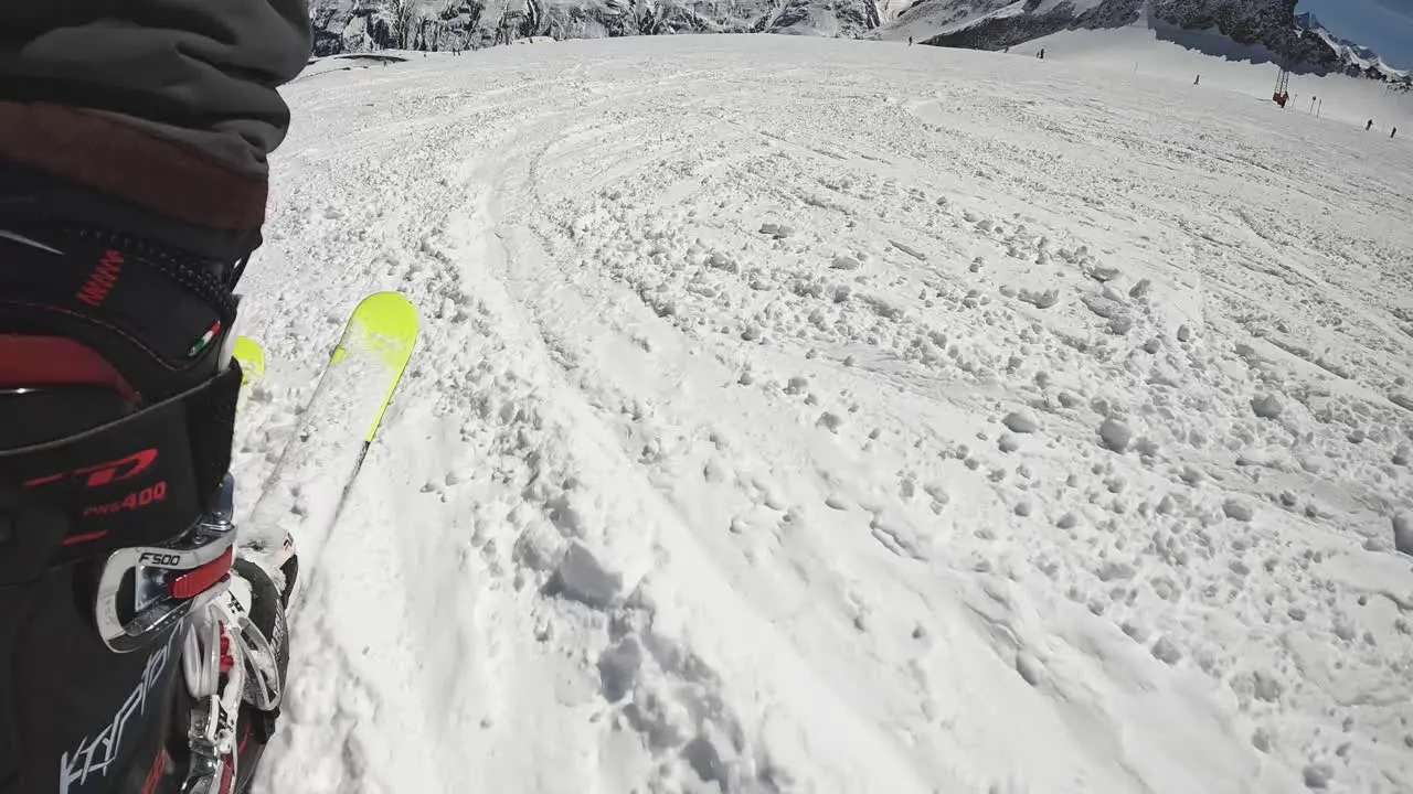 Low Angle POV Skier Skiing Down Snow Mountain Slope Solden Austria