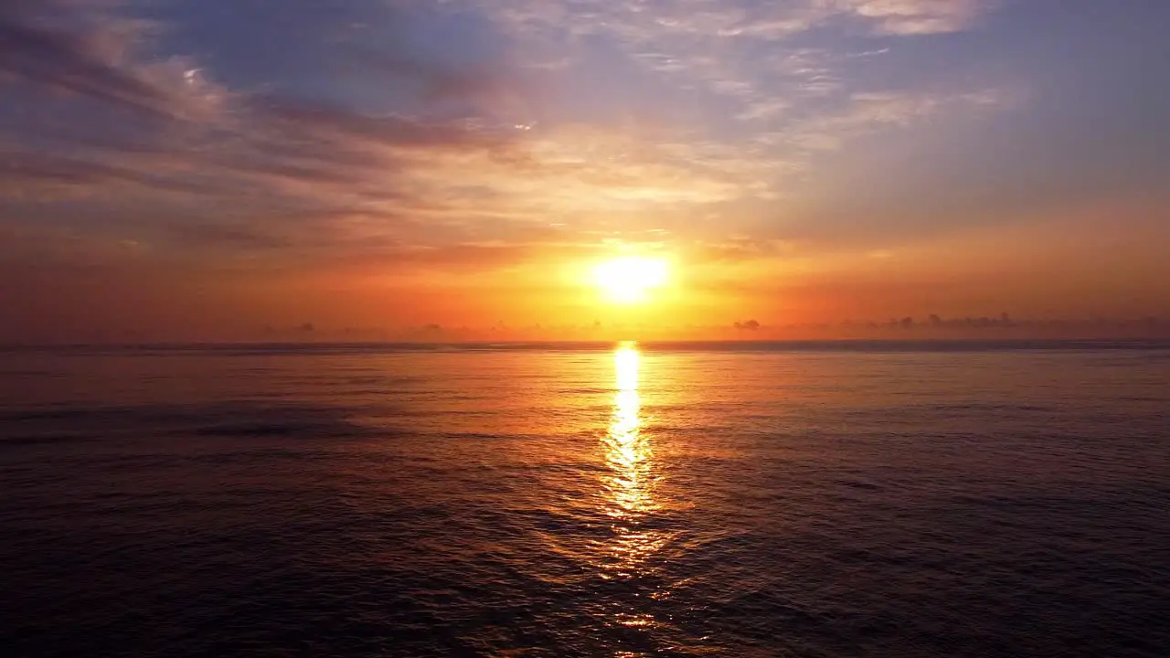 Sunset Drone Shot Flying Over Calm Ocean