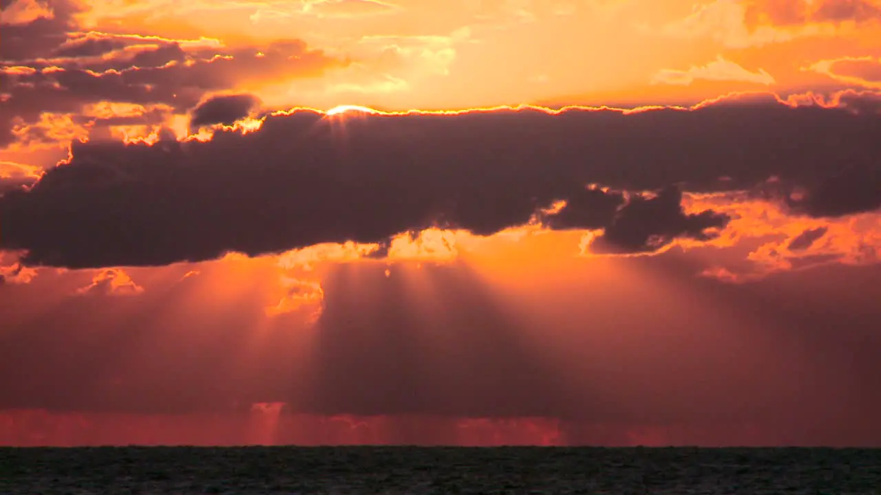 Time lapse of a beautiful orange sunset over a generic ocean