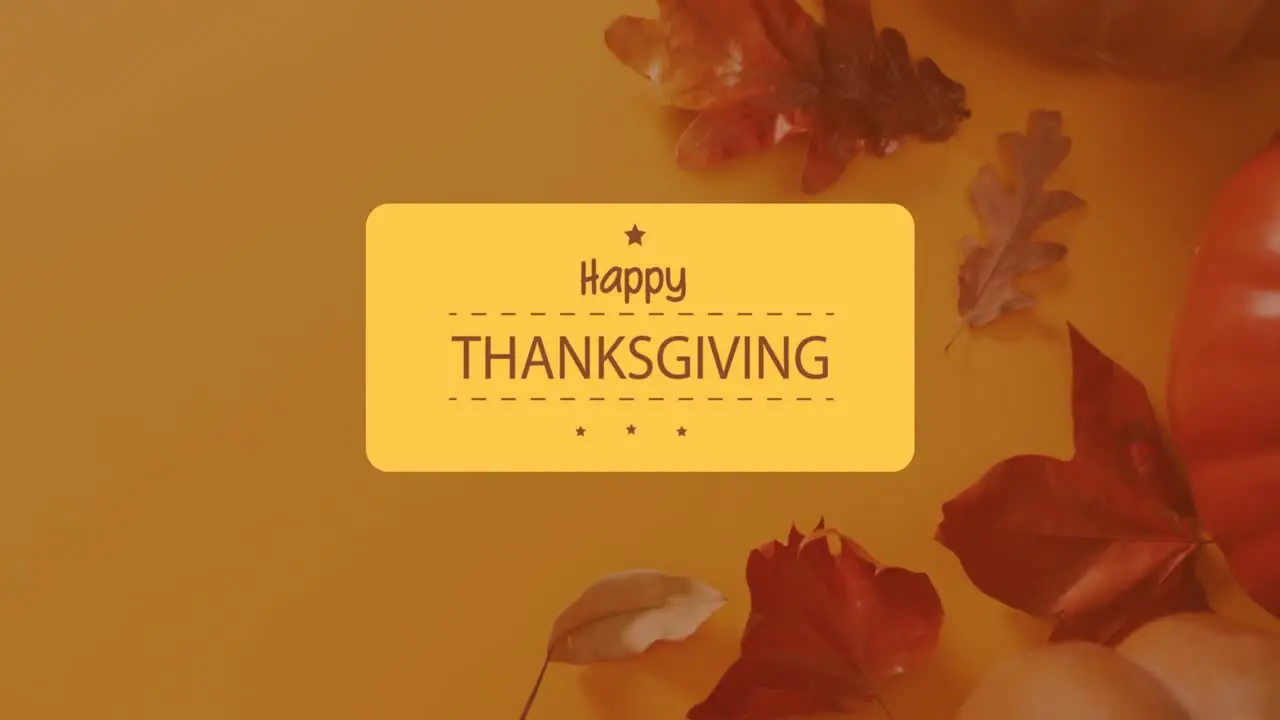 Animation of happy thanksgiving text over autumn leaves on orange background