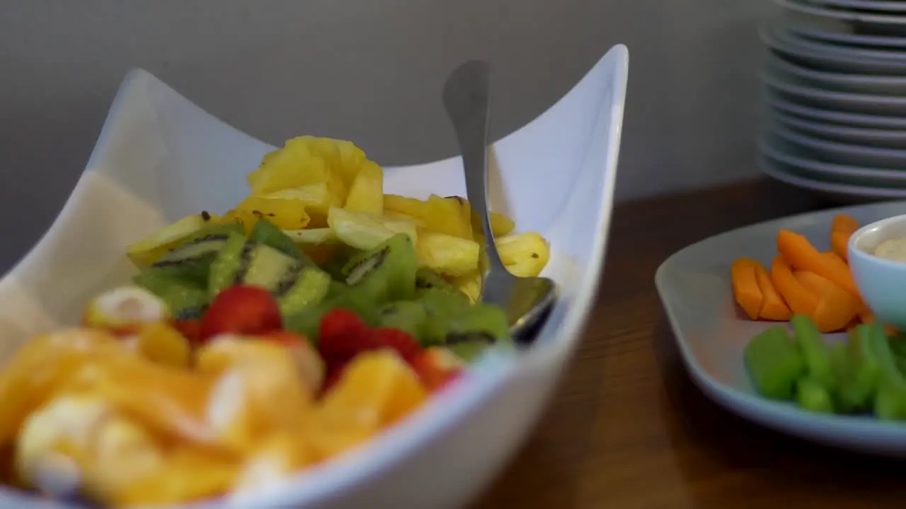 Close up shot of oranges strawberries and kiwis